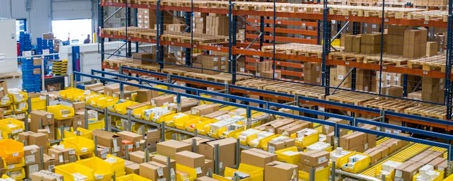 Warehouse shelves stocked with boxes across multiple godowns
